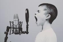 Boy shouting in microphone